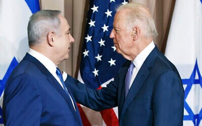 Then-prime minister Benjamin Netanyahu, left, and then-US vice president Joe Biden speak in front of media prior to a meeting on the sidelines of the World Economic Forum in Davos, Switzerland on January 21, 2016. (AP Photo/Michel Euler)