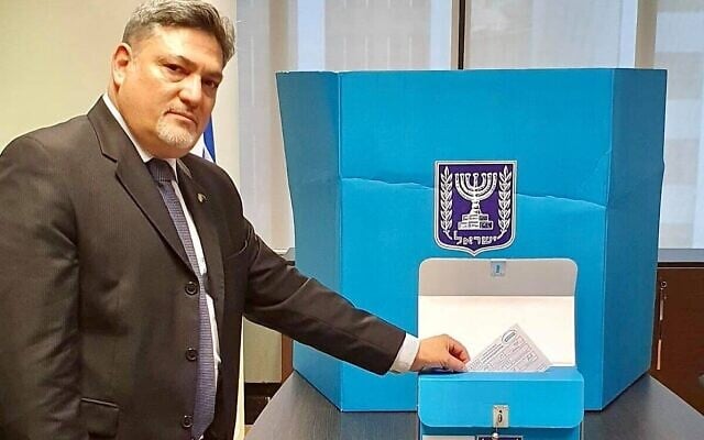 Ran Yaakoby, Israel's ambassador to New Zealand casting his ballot as early voting opened for diplomats in the coming elections, March 10, 2021 (Foreign Ministry) Ran Yaakoby, Israel's ambassador to New Zealand casting his ballot as early voting opened for diplomats in the coming elections, March 10, 2021 (Foreign Ministry)