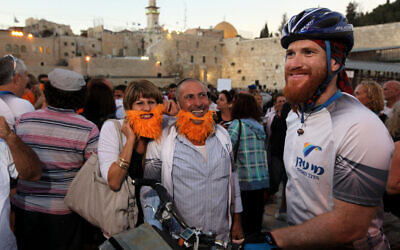 Israeli cyclist Roei Sadan with friends and family members in the Old City of Jerusalem, September 14, 2011, after completing a worldwide bike tour that spanned 1,458 days, 42 countries, 6 continents and 66,000 kilometers. (Kobi Gideon/Flash90)