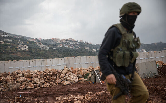 An IDF soldier walks near the border fence with Lebanon, near the northern Israeli city of Metula, on December 24, 2018. (Hadas Parush/Flash90) An IDF soldier walks near the border fence with Lebanon, near the northern Israeli city of Metula, on December 24, 2018. (Hadas Parush/Flash90)