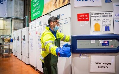 Illustrative: A worker at the Teva Pharmaceuticals logistics center in Shoham, where coronavirus vaccines are stored, on January 7, 2021. (Yossi Aloni/ Flash90)