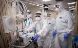 Shaare Zedek hospital team members wearing safety gear as they work in the coronavirus ward in Jerusalem on January 19, 2021. (Yonatan Sindel/Flash90)