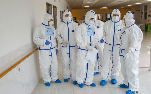 Ziv hospital team members wearing safety gear as they work on a coronavirus ward on February 04, 2021. (David Cohen/Flash90) Ziv hospital team members wearing safety gear as they work on a coronavirus ward on February 04, 2021. (David Cohen/Flash90)
