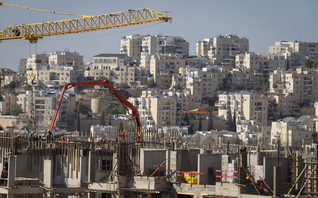 Construction work for new housing in the West Bank settlement of Modi'in Illit, on January 11, 2021. (Flash90) Construction work for new housing in the West Bank settlement of Modi'in Illit, on January 11, 2021. (Flash90)