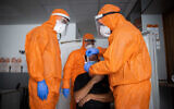 United Hatzalah medical workers test a patient for COVID-19 in Jerusalem on February 10, 2021. (Yonatan Sindel/Flash90)