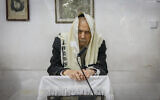 Rabbi Gershon Edelstein, head of the Ponovitz Yeshiva seen during a morning prayer at his home in Bnei Brak, February 15, 2021. (Yaakov Naumi/Flash90)