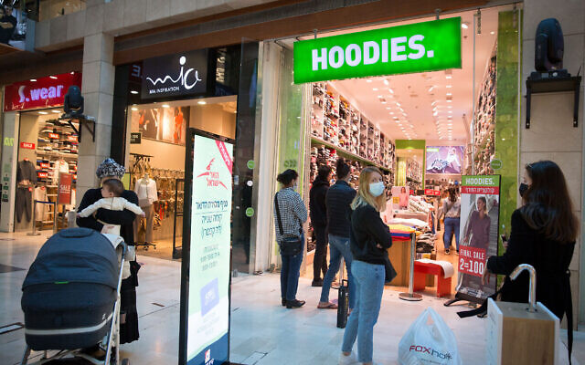 People shop at the Givatayim shopping mall, on February 21, 2021, after it reopened following a few weeks of lockdown. (Miriam Alster/Flash90) People shop at the Givatayim shopping mall, on February 21, 2021, after it reopened following a few weeks of lockdown. (Miriam Alster/Flash90)