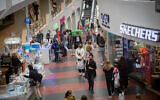 People shop at Dizengoff Center in Tel Aviv on February 22, 2021, after it reopened following a few weeks of lockdown. (Miriam Alster/Flash90)