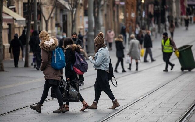 People walk on Jaffa street in downtown Jerusalem on March 1, 2021. (Yonatan Sindel/Flash90) People walk on Jaffa street in downtown Jerusalem on March 1, 2021. (Yonatan Sindel/Flash90)