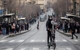 People walk on Jaffa Street, in downtown Jerusalem on March 1, 2021. (Yonatan Sindel/Flash90)
