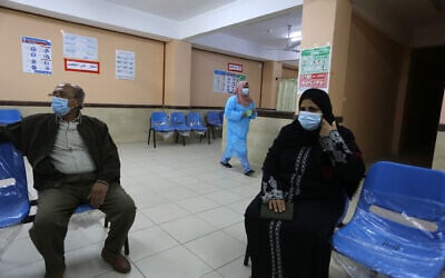 A medical worker of UNRWA gives a shot of the Sputnik V COVID-19 vaccine at UNRWA's clinic in the Rafah, in the southern Gaza, on March 3, 2021. (Abed Rahim Khatib/Flash90)