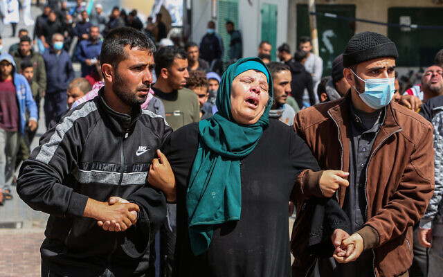 Family and relatives mourn the deaths of three fishermen from the Al-Lahham family in Khan Yunis, in the southern Gaza Strip, on March 7, 2021. Three Palestinian fishermen were killed when their boat exploded off Gaza's coast in the Mediterranean Sea. (Abed Rahim Khatib/Flash90) Family and relatives mourn the deaths of three fishermen from the Al-Lahham family in Khan Yunis, in the southern Gaza Strip, on March 7, 2021. Three Palestinian fishermen were killed when their boat exploded off Gaza's coast in the Mediterranean Sea. (Abed Rahim Khatib/Flash90)