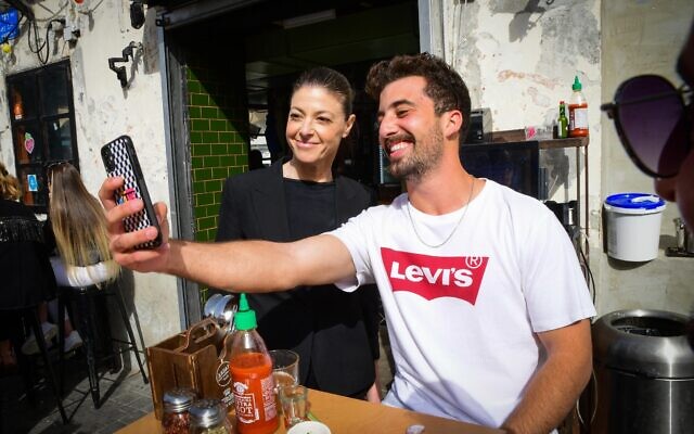 Labor Party leader Merav Michaeli (L) visits the Jaffa flea market on March 20, 2021. (Avshalom Sassoni/Flash90)