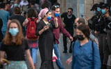 Israelis walk in Jerusalem on March 21, 2021. (Olivier Fitoussi/Flash90)