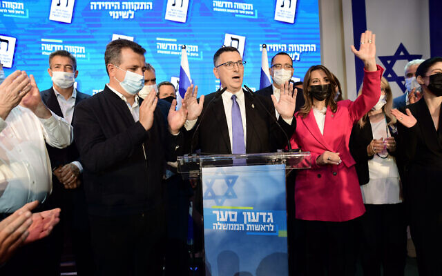 New Hope party leader Gideon Sa'ar and party members at the New Hope party headquarters in Tel Aviv, on election night, on March 23, 2021. (Tomer Neuberg/Flash90) New Hope party leader Gideon Sa'ar and party members at the New Hope party headquarters in Tel Aviv, on election night, on March 23, 2021. (Tomer Neuberg/Flash90)