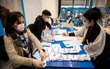 Central Election Committee workers count the remaining election ballots at the Knesset in Jerusalem, March 25, 2021. (Yonatan Sindel/Flash90)