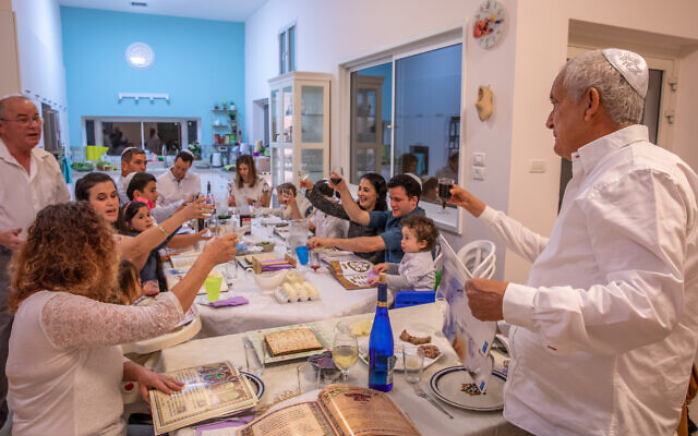 Illustrative photo of an Israeli family celebrating the Passover holiday in Moshav Yashresh on March 27, 2021. (Yossi Aloni/Flash90) Illustrative photo of an Israeli family celebrating the Passover holiday in Moshav Yashresh on March 27, 2021. (Yossi Aloni/Flash90)