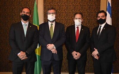 From right to left, a senior advisor to the Brazillian PM, Tzachi Braverman, Foreign Minister Ernesto Araujo, son of Brazilian President Jair Bolsonaro, during the meeting on March 9, 2021 (Jorge Novominsky/GPO)