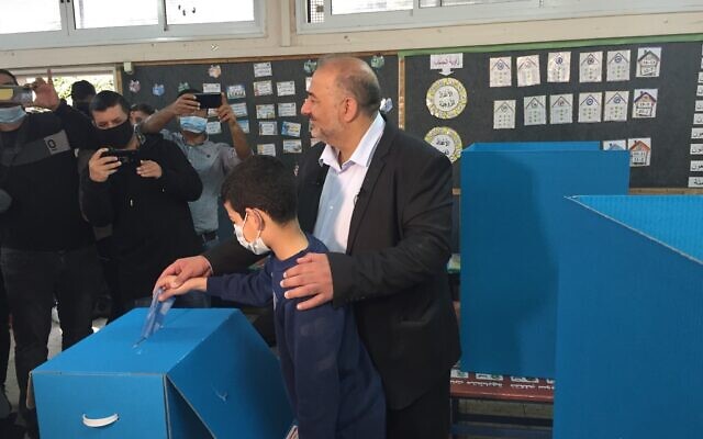 Ra'am party leader Mansour Abbas votes in the Knesset election in Maghar, March 23, 2021. (Aaron Boxerman/Times of Israel)