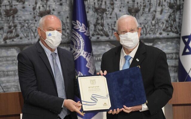 President Reuven Rivlin (R) receives the official election results from Central Elections Committee chairman Uzi Vogelman at the President's Residence in Jerusalem, March 31, 2021. (Amos Ben Gershom/GPO) President Reuven Rivlin (R) receives the official election results from Central Elections Committee chairman Uzi Vogelman at the President's Residence in Jerusalem, March 31, 2021. (Amos Ben Gershom/GPO)