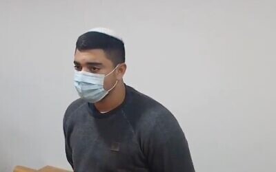 Afik Toibi, a border guard who is suspected of killing his comrade, Sgt. Naim Maadi, is indicted in a Haifa District Court on March 10, 2021. (Screen capture: Twitter)