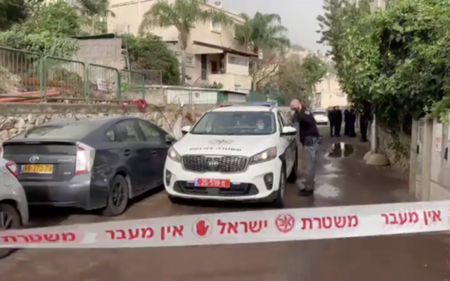Police and medics on the scene of a suspected murder in the city of Nesher (Screen capture: Channel 12 news) Police and medics on the scene of a suspected murder in the city of Nesher (Screen capture: Channel 12 news)