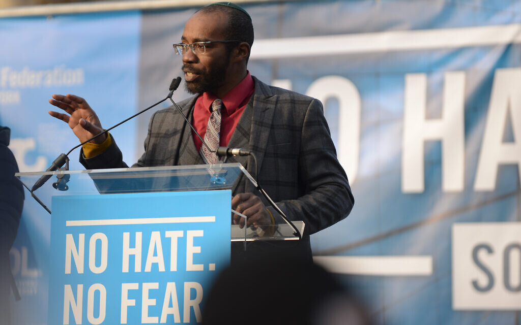 Rabbi Shais Rishon speaks at a rally in New York City, January 2020. (Gili Getz via JTA)