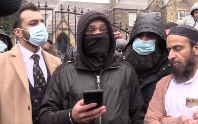 Protesters decry the use of a cartoon of the Prophet Muhammad in the British town of Batley, March 2021. (Twitter screenshot)