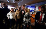 Former US Secretary of State Mike Pompeo, center, poses for a photo with audience members after speaking at the West Side Conservative Club, March 26, 2021, in Urbandale, Iowa. (AP Photo/Charlie Neibergall)
