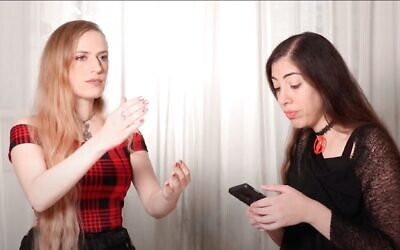 Noa Gruman, left, in the latest Hellscore video, created by the heavy metal choir during Israel's third coronavirus lockdown (Courtesy Hellscore)