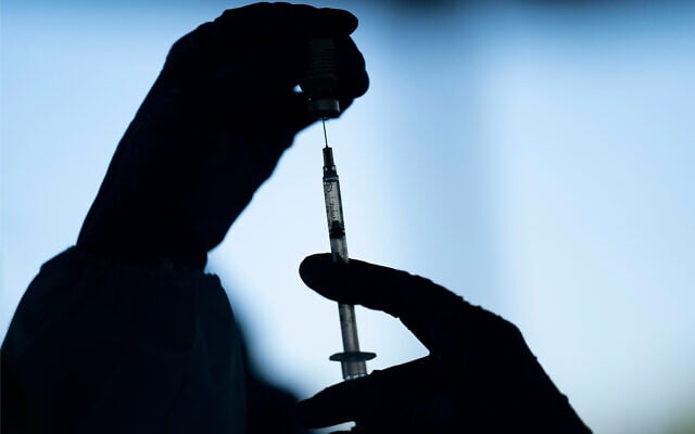 A medical worker prepares the Pfizer-BioNTech COVID-19 vaccine at Tudor Ranch in Mecca, California, January 21, 2021. (AP Photo/Jae C. Hong, File) A medical worker prepares the Pfizer-BioNTech COVID-19 vaccine at Tudor Ranch in Mecca, California, January 21, 2021. (AP Photo/Jae C. Hong, File)