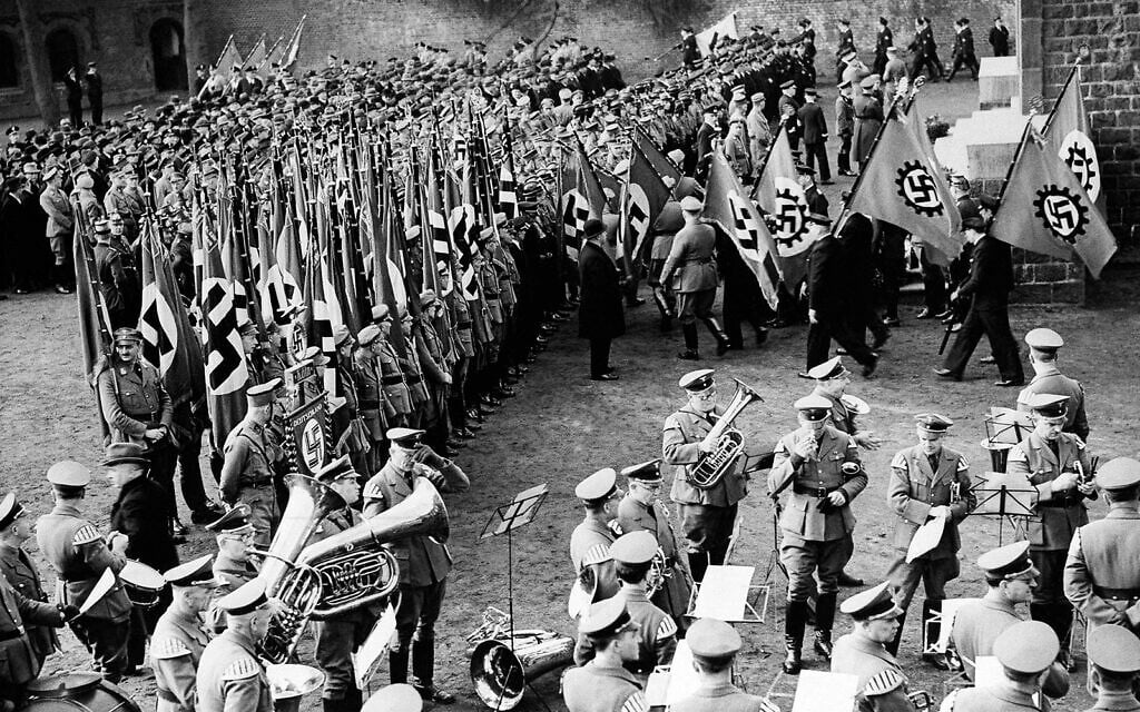Nazi soldiers hold a colorful ceremony in Cologne, Germany, celebrating the reoccupation of the Rhineland, March 8, 1936. (AP)