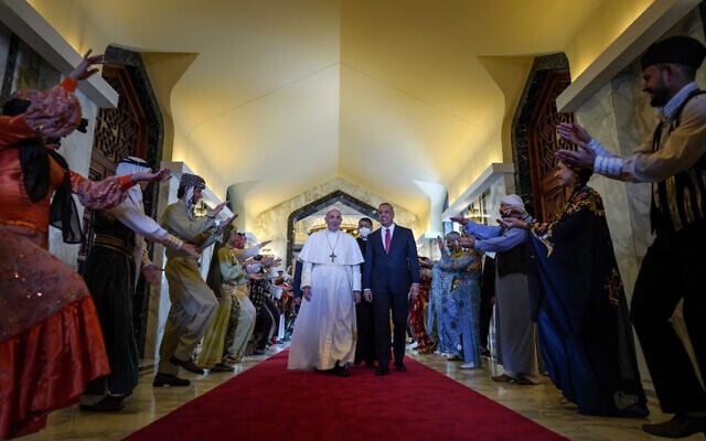 Iraq's Prime Minister Mustafa al-Kadhemi (R) welcomes Pope Francis at Baghdad International Airport's VIP Lounge, on March 5, 2021. (Ayman HENNA / AFP) Iraq's Prime Minister Mustafa al-Kadhemi (R) welcomes Pope Francis at Baghdad International Airport's VIP Lounge, on March 5, 2021. (Ayman HENNA / AFP)