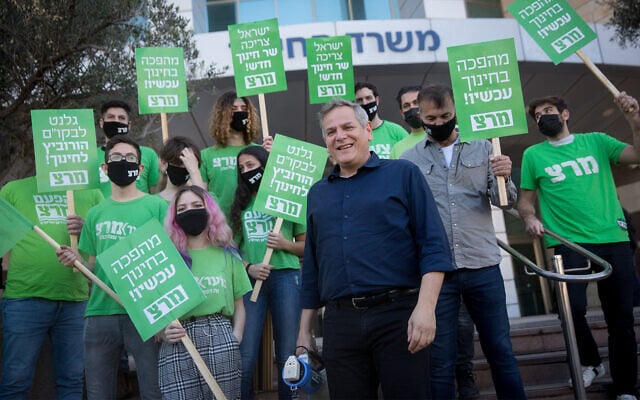 Head of the left-wing Meretz party with supporters outside of the Education Ministry in Tel Aviv, February 9, 2021. (Miriam Alster/FLASH90) Head of the left-wing Meretz party with supporters outside of the Education Ministry in Tel Aviv, February 9, 2021. (Miriam Alster/FLASH90)