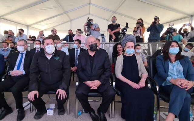 Prime Minister Benjamin Netanyahu (center) and members of his Likud party at an inauguration ceremony for a new neighborhood in the West Bank settlement of Revava, March 23, 2021. (Roy Hadi/Shomron Regional Council) Prime Minister Benjamin Netanyahu (center) and members of his Likud party at an inauguration ceremony for a new neighborhood in the West Bank settlement of Revava, March 23, 2021. (Roy Hadi/Shomron Regional Council)