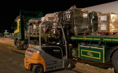 A forklift loads medical equipment onto an airplane on March 10, 2021, for an Israeli delegation heading to Equatorial Guinea following a massive explosion in the African country that injured hundreds. (Israel Defense Forces)