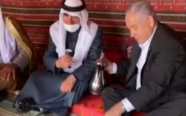 Prime Ministher Benjamin Netanyahu pours coffee for Bedouin leaders in southern Israel during a visit with members of the community, March 7, 2021. (video screenshot) Prime Ministher Benjamin Netanyahu pours coffee for Bedouin leaders in southern Israel during a visit with members of the community, March 7, 2021. (video screenshot)