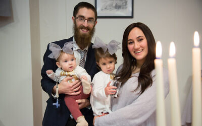Rabbi Avi Feldman, left, and wife Mushky, with their two daughters, Chana and Batsheva, before moving to Iceland in 2018 to become the Chabad emissaries there. (Chabad.org via JTA)