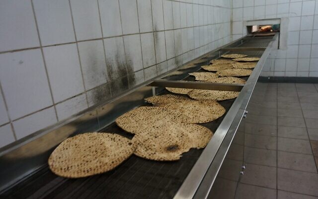 Illustrative: Matzahs travel on the production line of the Tiferet HaMatzot factory in Dnepro, Ukraine, December 8, 2014. (Cnaan Liphshiz/JTA) Illustrative: Matzahs travel on the production line of the Tiferet HaMatzot factory in Dnepro, Ukraine, December 8, 2014. (Cnaan Liphshiz/JTA)