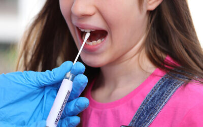 Illustrative: A girl takes a coronavirus test. (ChiccoDodiFC via iStock)