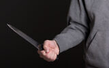 Illustrative: A knife in a male hand. (iStock)