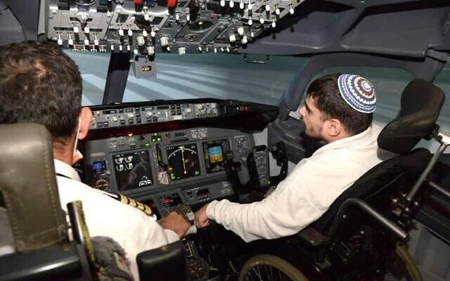 On Good Deeds Day on March 16, 2021, four ADI residents became the world’s first wheelchair users to train in an advanced flight simulator, each enjoying 60-minute flight instruction simulations with the guidance of an El Al pilot (Liat Mandel) On Good Deeds Day on March 16, 2021, four ADI residents became the world’s first wheelchair users to train in an advanced flight simulator, each enjoying 60-minute flight instruction simulations with the guidance of an El Al pilot (Liat Mandel)