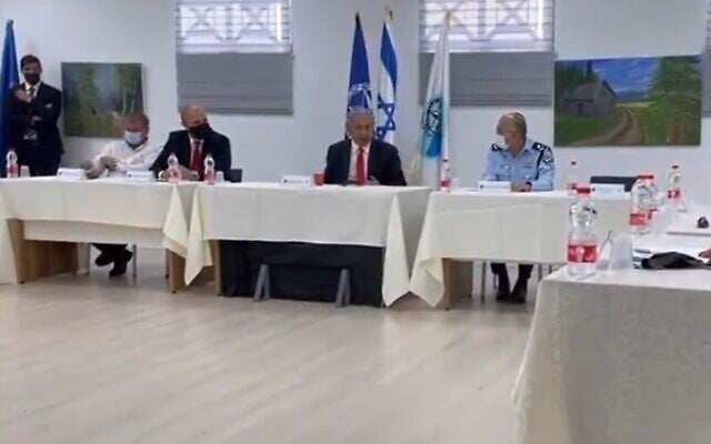 Prime Minister Benjamin Netanyahu (2nd R) meets with senior police officers, March 17, 2020 (Screen grab) Prime Minister Benjamin Netanyahu (2nd R) meets with senior police officers, March 17, 2020 (Screen grab)