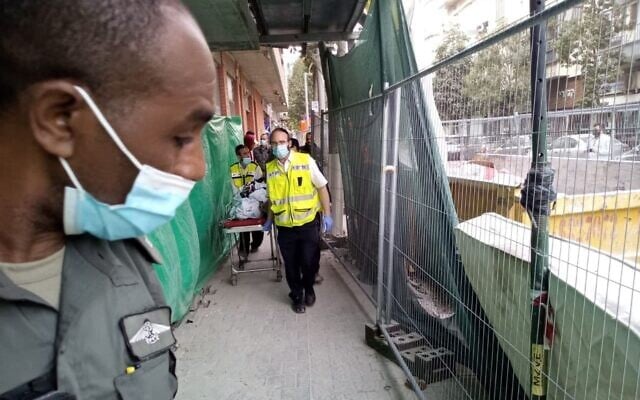 Border Police and ZAKA members operate in the building site in Tel Aviv where a Palestinian man fell to his death following a police chase on March 24, 2021 (ZAKA spokesperson)
