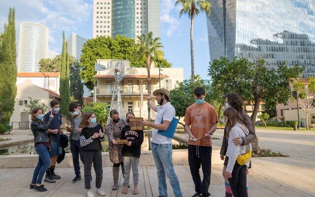 Taking a tour in Tel Aviv's Sarona complex, one of many being offered in the city over the Passover 2021 holiday (Courtesy Riki Rahman)