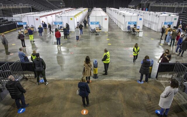 People wait to receive a dose of the AstraZeneca/Oxford vaccine at the SSE Arena which has been converted into a temporary COVID-19 vaccination center, in Belfast, Northern Ireland on March 29, 2021. (Paul Faith / AFP) People wait to receive a dose of the AstraZeneca/Oxford vaccine at the SSE Arena which has been converted into a temporary COVID-19 vaccination center, in Belfast, Northern Ireland on March 29, 2021. (Paul Faith / AFP)