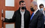 Prime Minister Benjamin Netanyahu leaves the courtroom at Jerusalem District Court on April 5, 2021, during his corruption trial. (Abir SULTAN / POOL / AFP)