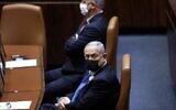 Prime Minister Benjamin Netanyahu (R) and Defense Minister Benny Gantz attend the swearing-in ceremony of Israel's Knesset (parliament) in Jerusalem, on April 6, 2021. (Alex Kolomoisky / POOL / AFP)