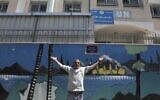 A Palestinian man gestures outside a United Nations health center in the Palestinian refugee camp of Jalazoun near Ramallah on April 8, 2021. (ABBAS MOMANI / AFP)