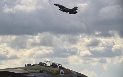 A Hellenic Air Force F-16 jet takes off behind an Israeli F-15 from the military airport of Andravida in southern Greece, as part of the Hellenic Air Force's 'INIOCHOS 2021' multinational aviation exercise on April 19, 2021. (ARIS MESSINIS / AFP)
